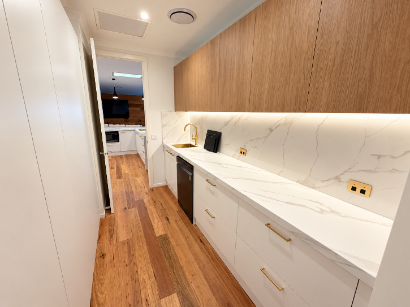 Custom white kitchen cabinet with blue island made by Cabco Kitchens